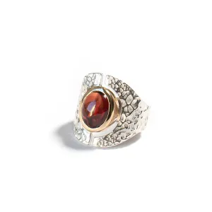 Mixed metal open oval garnet cabochon ring